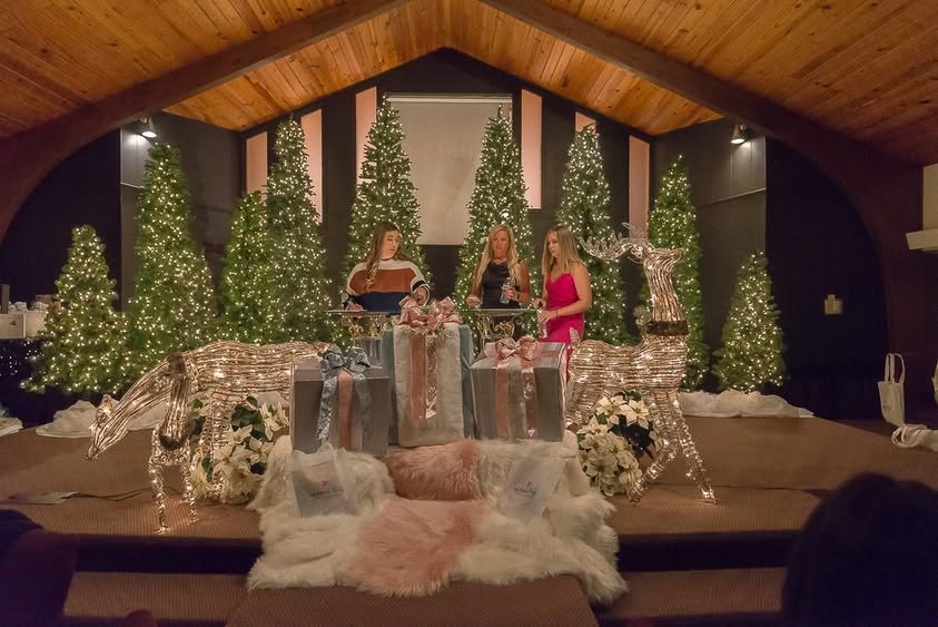 Presenters on the decorated stage