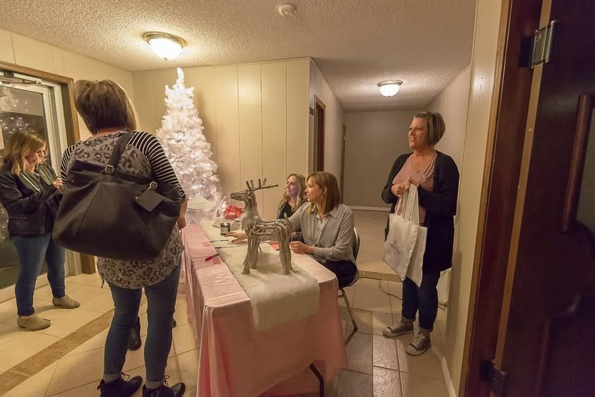 Guests arriving at the welcome table